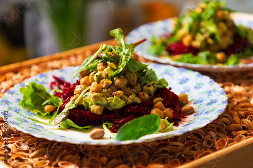 Fresh vegeterian salad on the plates
