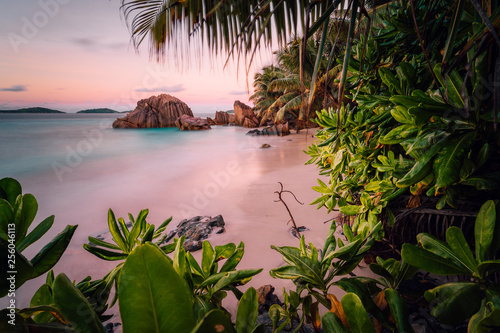 Paradise exotic beach on La Digue Island, Seychelles. Long Exposure during amazing sunset