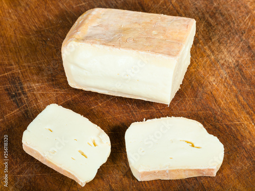 sliced local italian Taleggio cheese on board