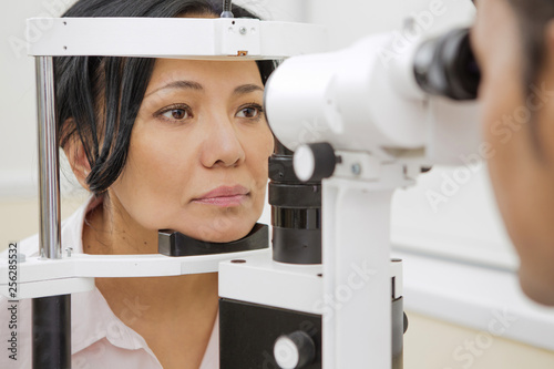 Mature woman having ophthalmological examination