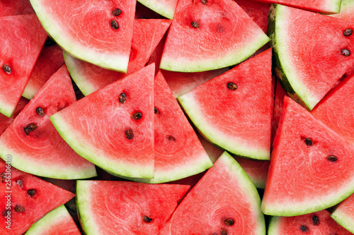heap of watermelon slices as background