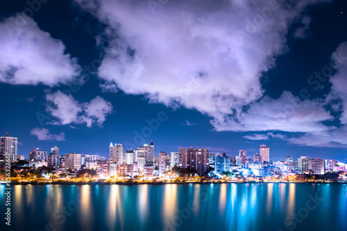 Beautiful Condado Beach, San Juan Puerto Rico seen at night with bay, buildings and lights