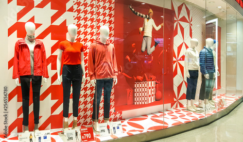 Front of Uniqlo store. Luxury and fashionable brand window display. Winter collection Welcoming the Christmas Festival.