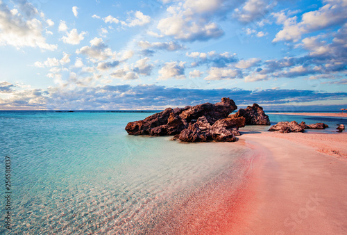 Crete skyline. Elafonissi beach with pink sand against blue sky with clouds on Crete, Greece