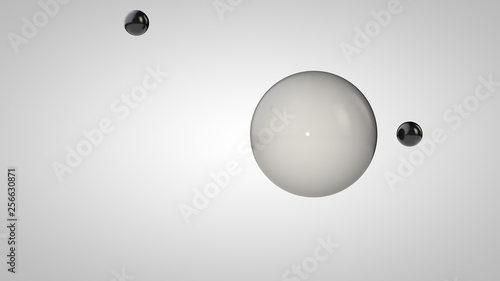 3D illustration of black and white balls, one large and two small balls. Spheres in the air, isolated on a white background. 3D rendering of an abstraction. Space with geometric, round objects.