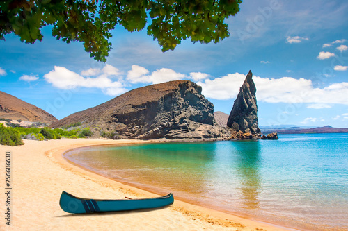 Galapagos Islands. Ecuador. Bartolome Island. Pinnacle Rock. Rocks in the water next to the sandy beach. Blue lagoon. Landscapes of the Galapagos.