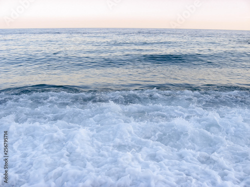 beautiful sea waves with foam in a hot sunny day. summer vacation concept. nobody is here