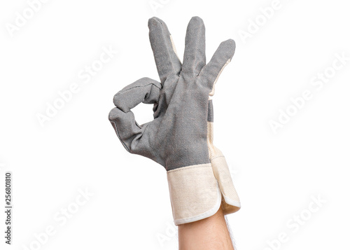 Worker showing gesture - ok sign. Male hand wearing working glove, isolated on white background.