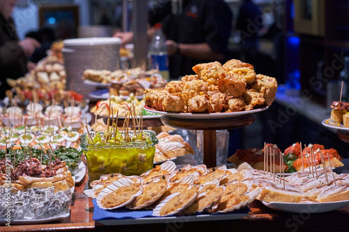 Pinchos and tapas typical of the Basque Country, Spain. Selection of different types of foods to choose from. San Sebastian