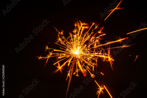 Hot fire sparks explosive fuse and flash from welding isolated on black.