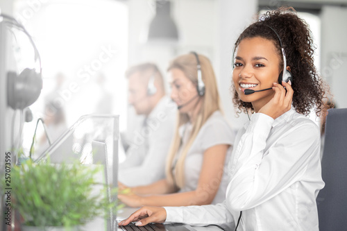 Call center worker accompanied by her team.