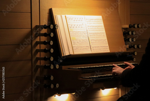 Detail of a man playing a church organ