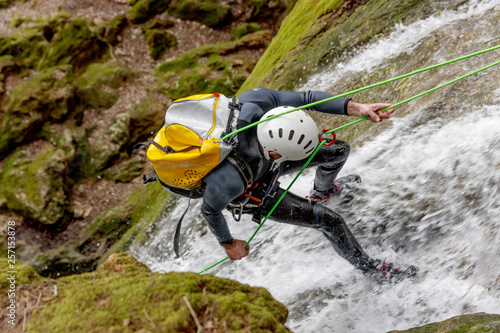 man practicing canyoning