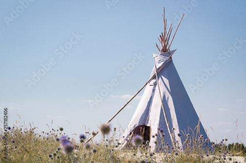 Summer vacation camping tent, indian wigwam hut, in dry wild prairie steppe desert