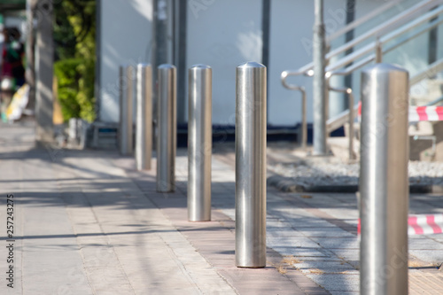 stainless steel bollards on footpath.