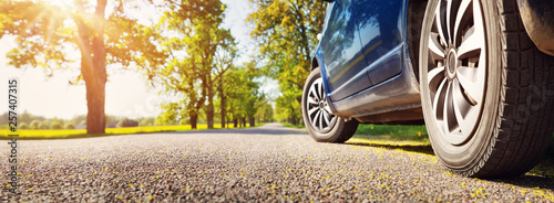 Car on asphalt road in summer