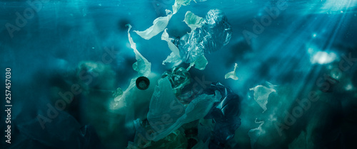 Toxic plastic waste floating underwater in the ocean