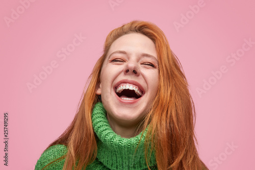 Wonderful laughing girl on pink background
