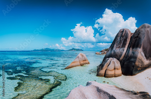 Bizarre huge granite rocks boulders at the famoust Anse Source d'Argent beach on island La Digue in Seychelles. Exotic paradise scenery concept