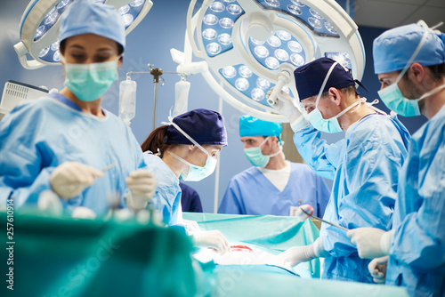 Group of surgeons in operating room