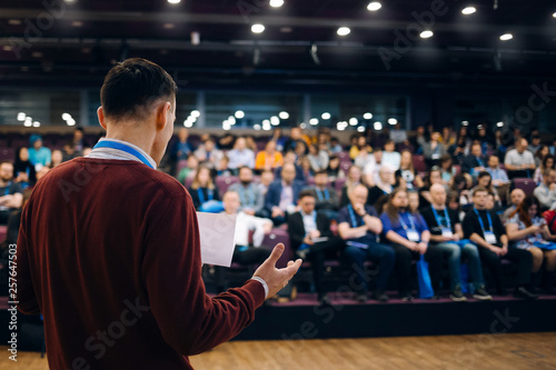 Speaker at business conference and presentation. Audience at the conference hall.