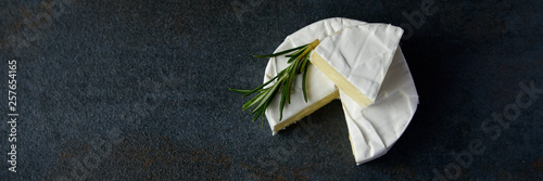 Cheese camembert or brie with fresh rosemary