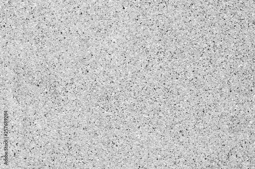 rugged concrete wall texture background fine white surface grunge grey cement construction building structure. gravel or Scree.