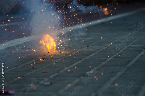 Firecrackers exploding in the street for the Fallas celebration in Valencia.