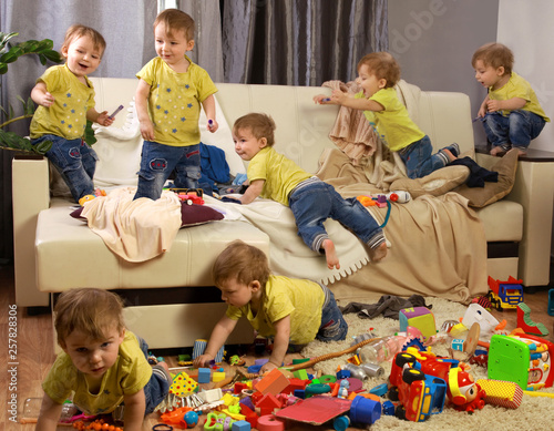 Child scattered toys. Children's room. Mess in the house. a lot of children, Madness in the children's room. children jumping on couch