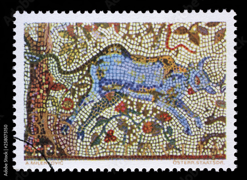 Stamp issued in Yugoslavia shows the bull near the cherry tree, mosaic series, circa 1970.