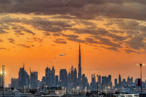 Dubai skyline in sunset orange colors