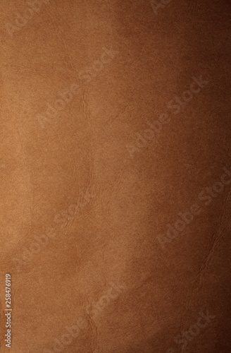 Brown cardboard texture, background, abstraction, gradient. Paper space for text.