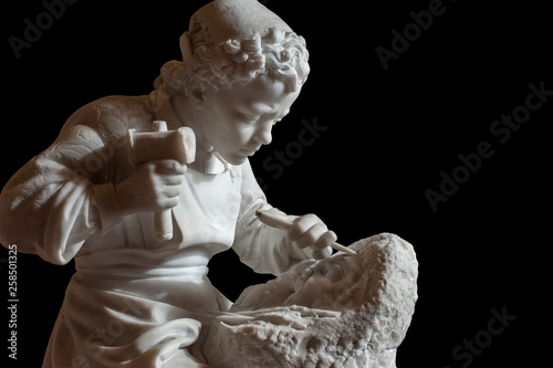 “Michelangelo as a kid” sculpted in 1862 by Emilio Zocchi. Cut out on black background..