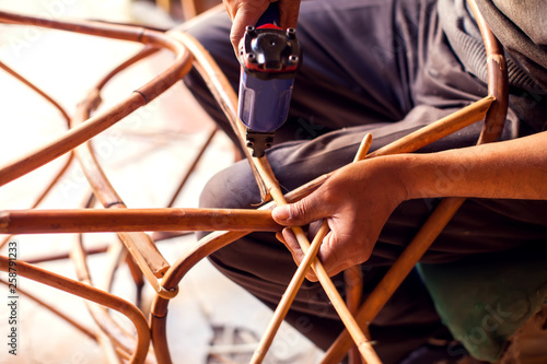 Furniture rattan chair and table decoration in process of manufacturing