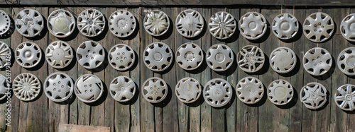 Big collection hubcaps on wall