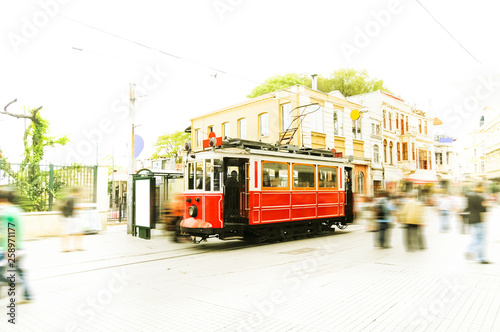 Old red tram goes on Istiklal street 