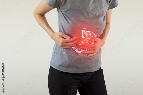 Digital composite of highlighted stomach of woman