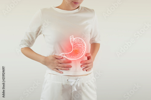 Digital composite of highlighted stomach of woman