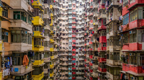 Aerial view of Yick Fat Building, Quarry Bay, Hong Kong. Residential area in old apartment with windows. High-rise building, skyscraper with windows of architecture in urban city.