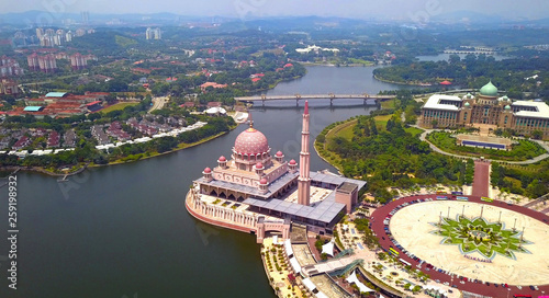 Aerial view of Putra mosque with garden landscape design and Putrajaya Lake, Putrajaya. The most famous tourist attraction in Kuala Lumpur City, Malaysia