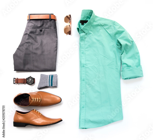 Men's casual outfits for man clothing with blue shirt , watch, sunglasses, trousers, socks and office shoes isolated on white background, Top view. pack shot