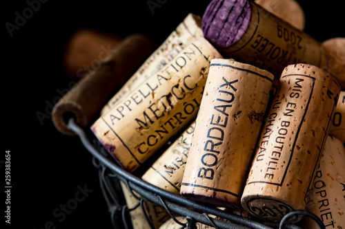 old cork stoppers of French wines in a wire basket