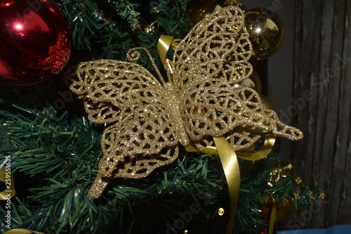 Beautiful butterfly on Christmas tree on winter Christmas holidays