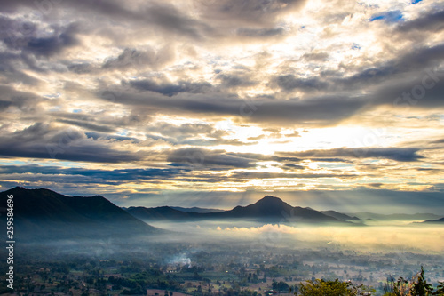 Sunrise at Phu Thok, view misty morning around with mist and cloudy sky, beautiful mountain. Khan District, Loei, Thailand