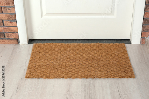 New clean mat near entrance door. Household item