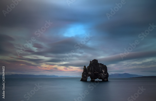 Mystical lonely Rock in the sea, named 'Drinking monster, dragon, mammoth or horse' (Hvitserkur rock, Iceland)