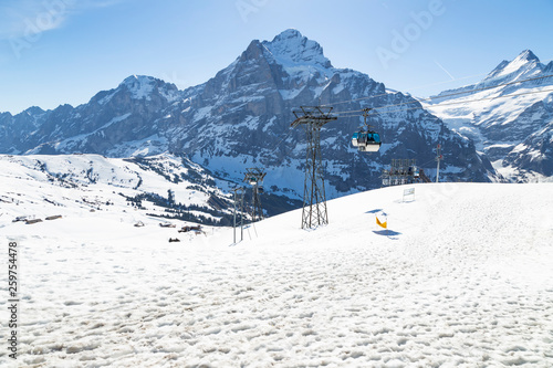 Gondola lift with tower from Grindelwald to First peak cable car station,