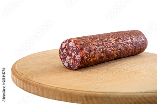 smoked sausage on a wooden board and on a white background