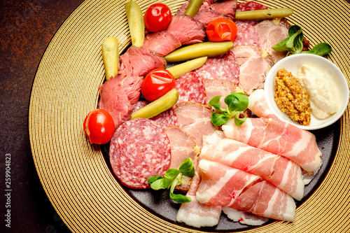 Party Platter of Assorted Cured Meats with sauce and pickles