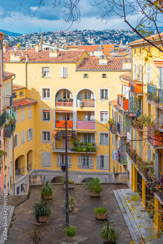 Nice in France, building yard with typical colorful facades in the old town, French Riviera 